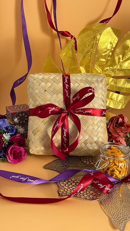 Front cover of anbu deepavali gift box with red ribbon